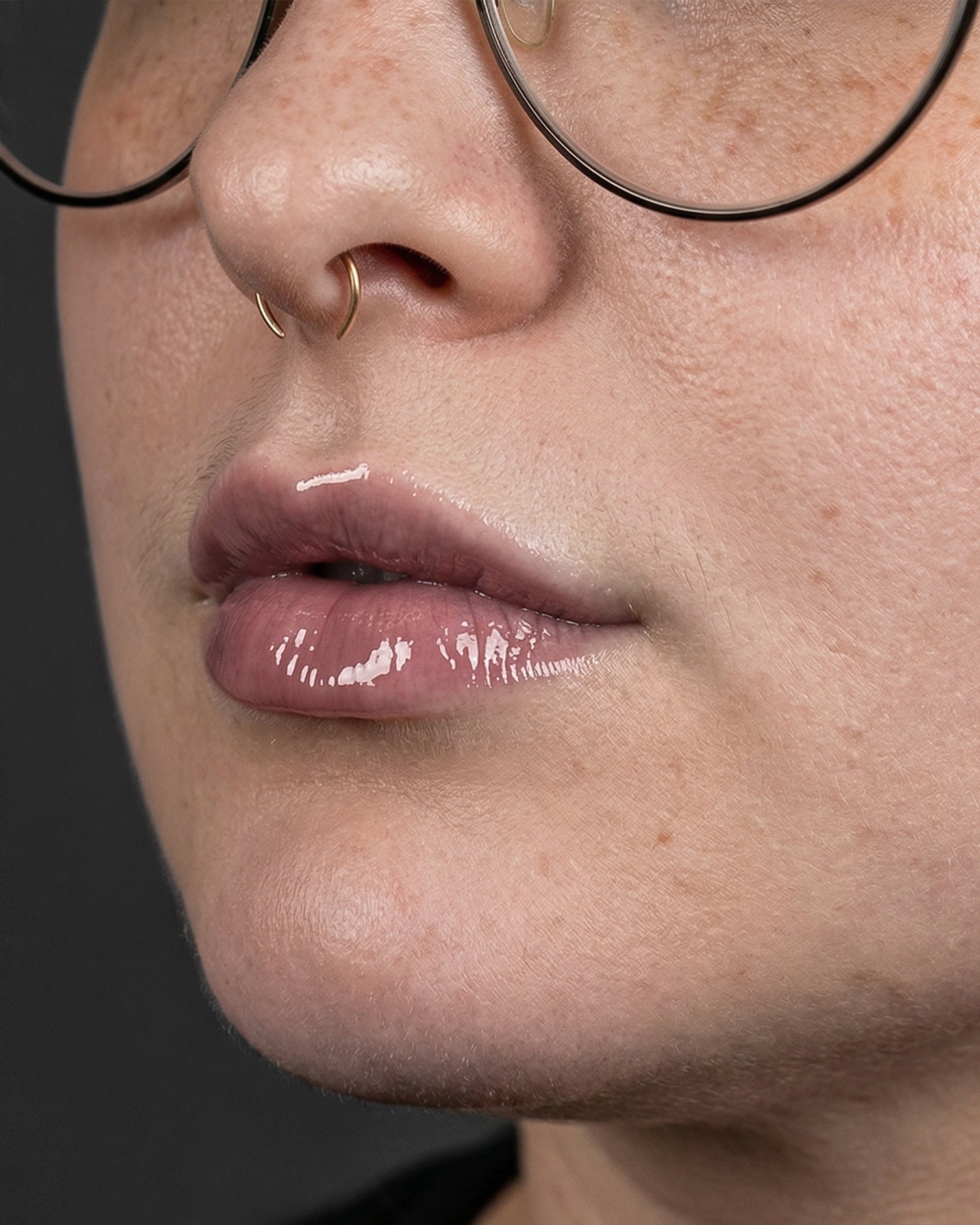 Close-up of a person's lips with a dark background