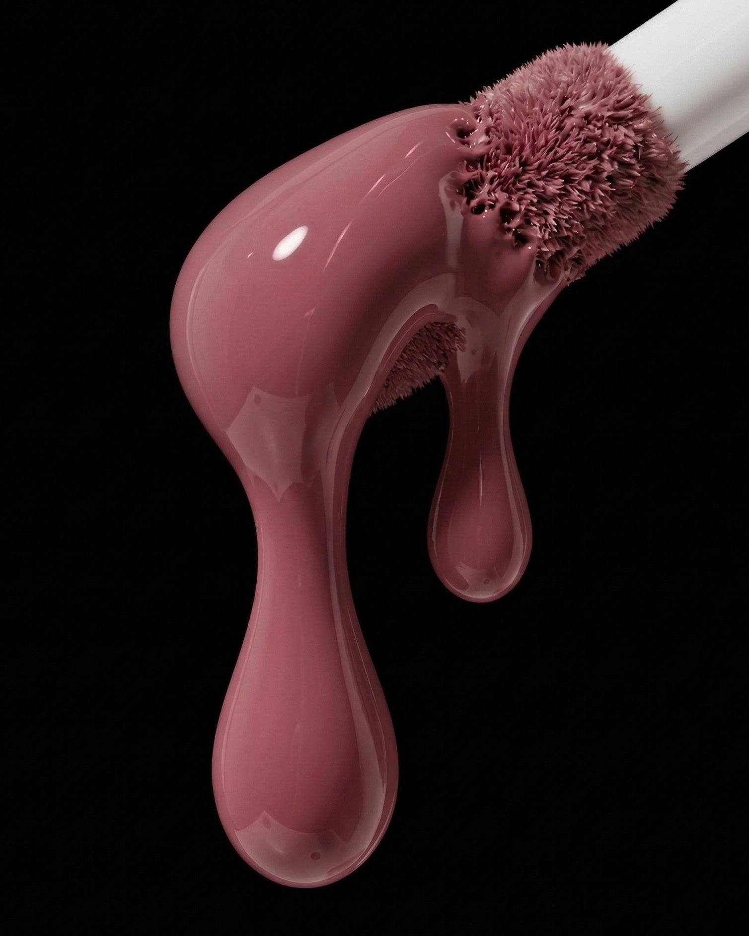 Makeup brush with pink liquid dripping from it on a black background